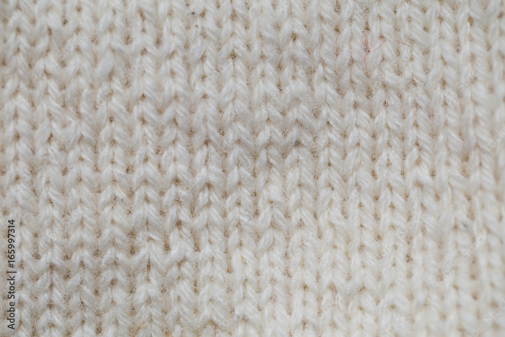 A beautiful closeup of a hand knitted warm and soft wool pattern. Soft socks or scarf of natural wool. Colorful pattern. A beautiful closeup of a hand knitted warm and soft wool pattern. Soft socks or scarf of natural wool. Colorful pattern.