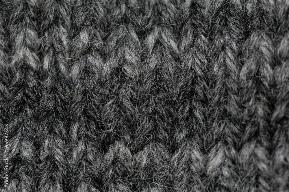A beautiful closeup of a hand knitted warm and soft wool pattern. Soft socks or scarf of natural wool. Colorful pattern. A beautiful closeup of a hand knitted warm and soft wool pattern. Soft socks or scarf of natural wool. Colorful pattern.