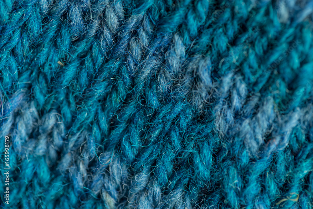 A beautiful closeup of a hand knitted warm and soft wool pattern. Soft socks or scarf of natural wool. Colorful pattern. A beautiful closeup of a hand knitted warm and soft wool pattern. Soft socks or scarf of natural wool. Colorful pattern.