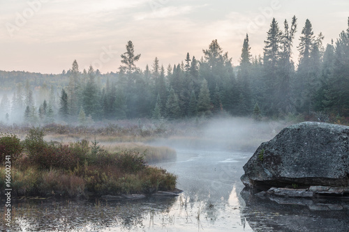 Misty morning over the lake in Algonquin Park in autumn photo