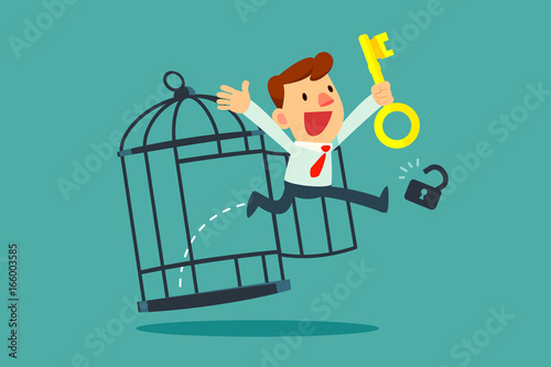 businessman with golden key free himself from cage