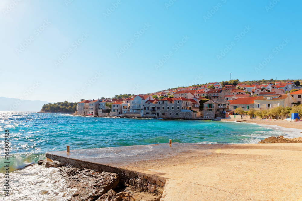 Small pebble beach of Postira town on Brac island - Croatia