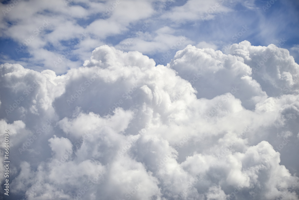 Dramatic cumulus clouds with high level cirrocumulus clouds for use as background Dramatic cumulus clouds with high level cirrocumulus clouds for use as background