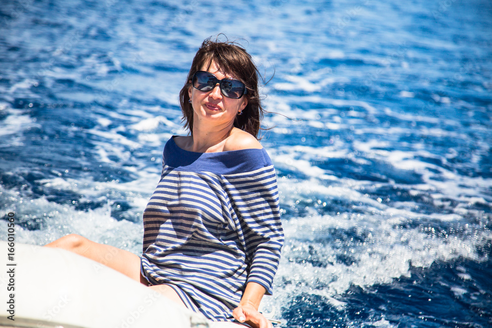 Young beautiful woman on the sea. Young beautiful woman on the sea.