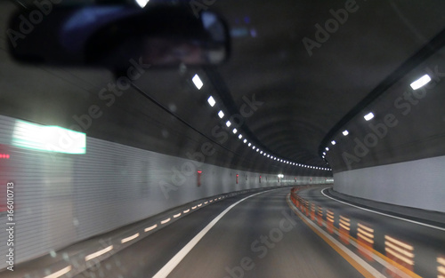 Driving car through empty tunnel