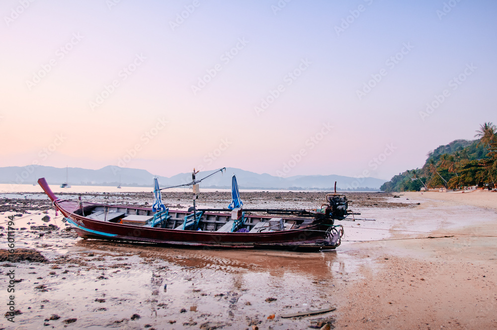 Beautiful sunset on the sea with traditional thai longtail boat. Beautiful sunset on the sea with traditional thai longtail boat.