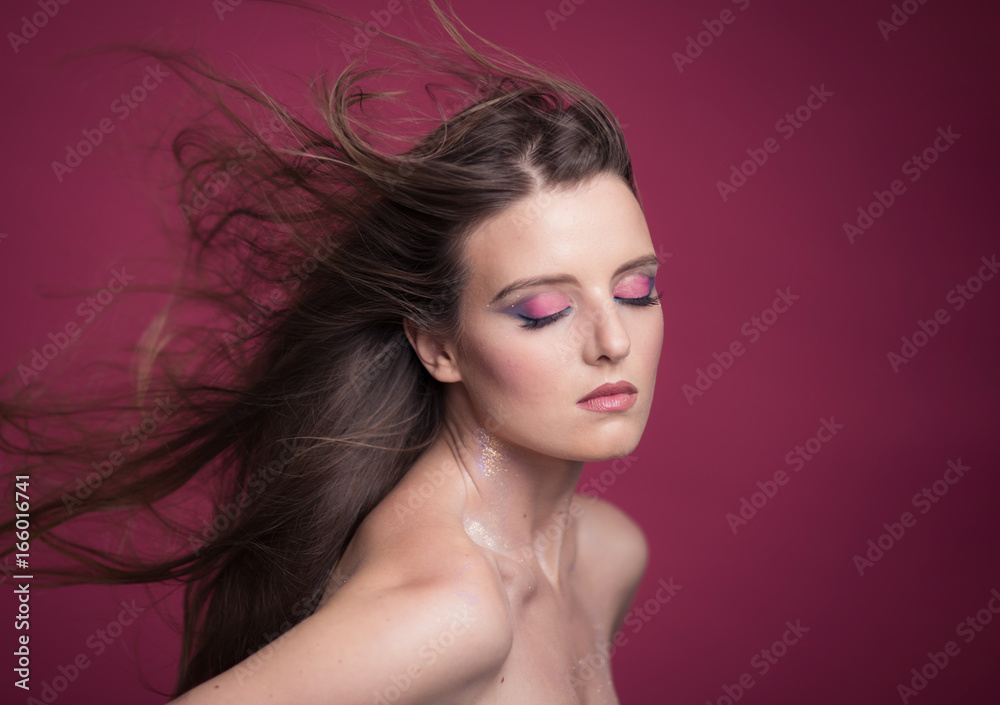 Naklejka premium Portrait of beautiful young woman with bright make-up
