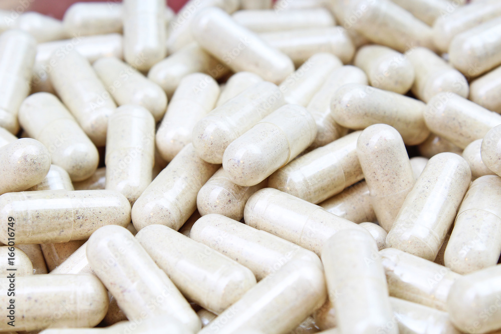 Pills. White capsules. Pills. White capsules.