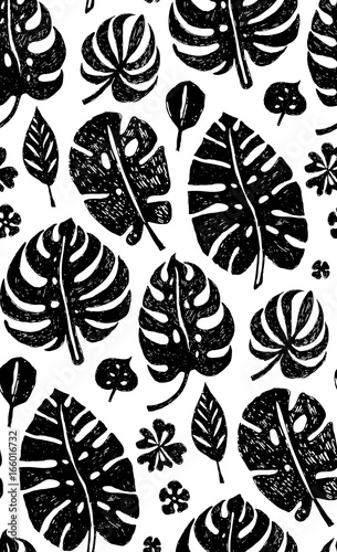 Seamless trendy black pattern with exotic Monstera palm leaves on a white bac...