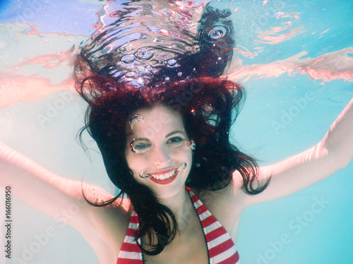 happy beautiful woman portrait smile underwater