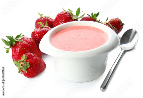 Homemade strawberry yogurt in bowl on white background