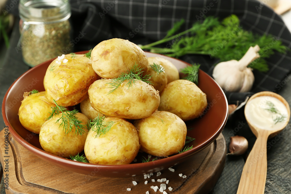 Composition with boiled potatoes on table, closeup Composition with boiled potatoes on table, closeup