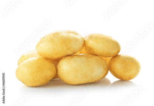 Organic raw potatoes on white background