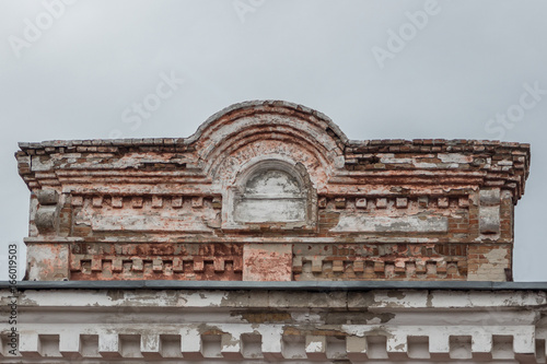 The upper part of the old dilapidated brick building. photo