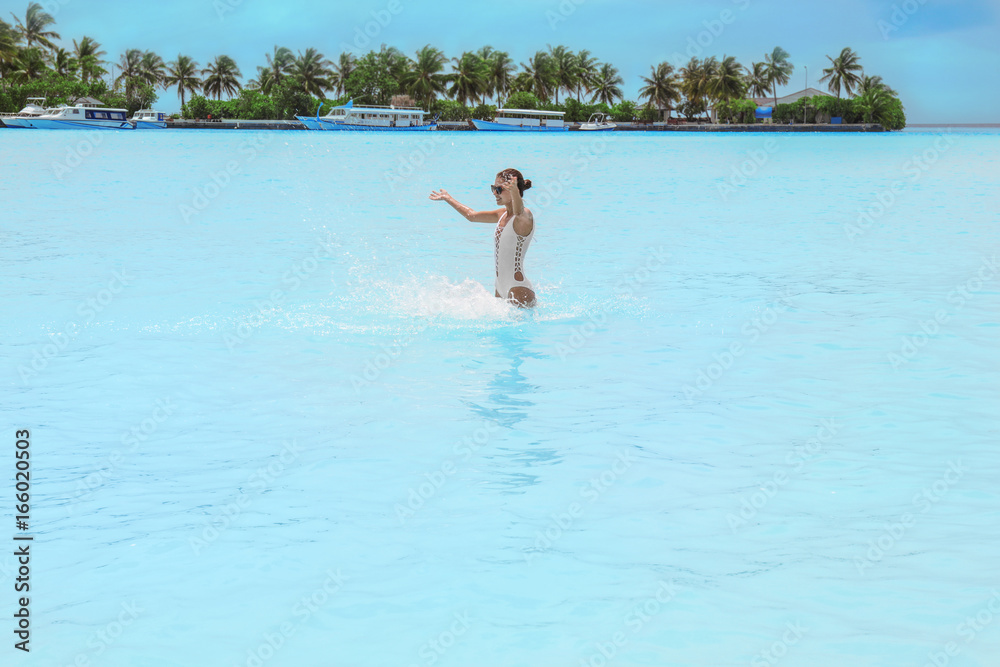 Beautiful young woman bathing at sea resort Beautiful young woman bathing at sea resort