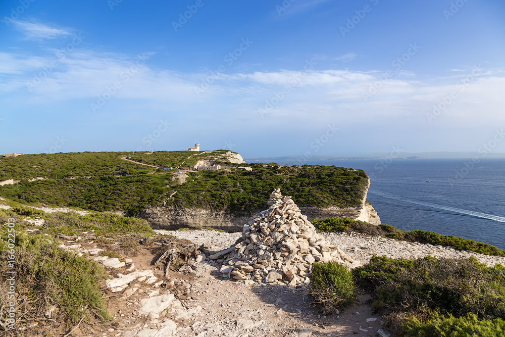 Bonifacio, Corsica, France. Pyramid of stones on the beach