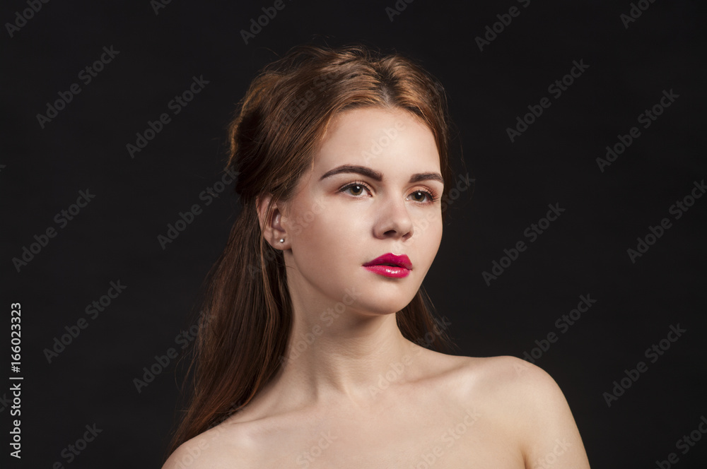 Portrait of a girl on a dark background. Portrait of a girl on a dark background.