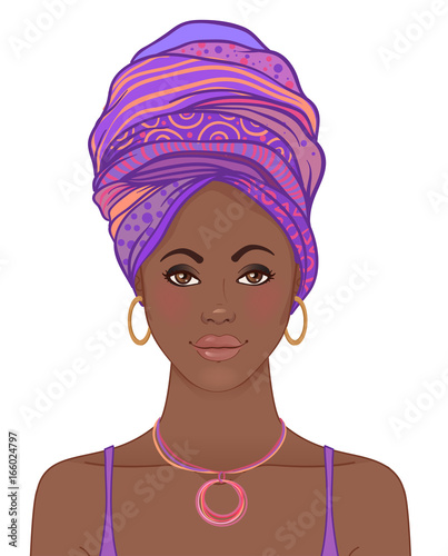 Portrait of beautiful African woman in turban. Tribal style fashion.
