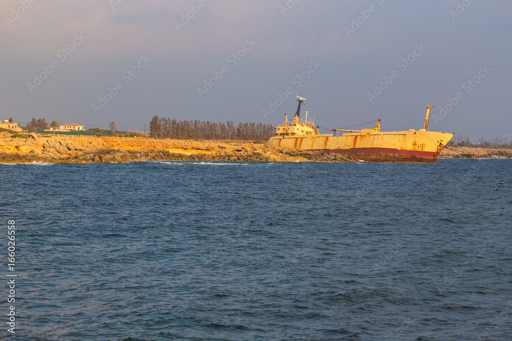 Sea view and shipwreck at sunset in Paphos, Cyprus