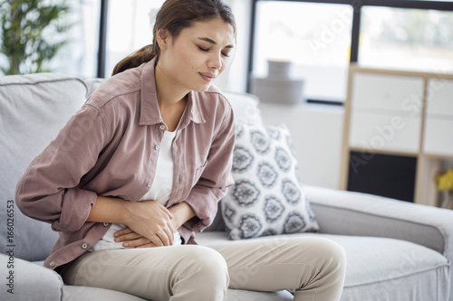 Young woman with stomach pain