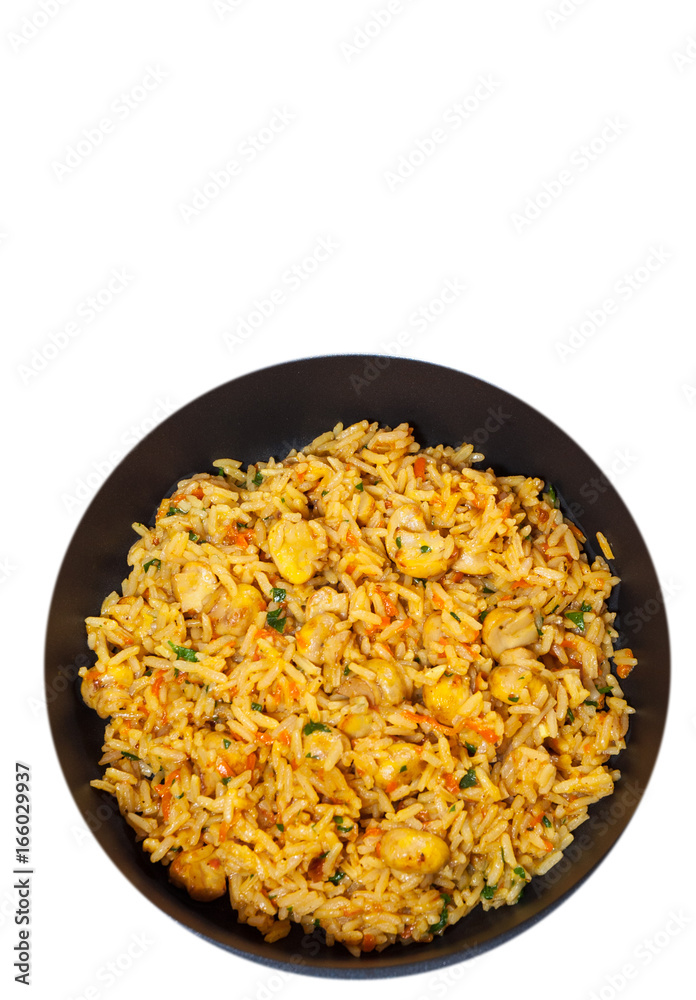 rice with mushrooms in a frying pan. top view. isolated on white rice with mushrooms in a frying pan. top view. isolated on white
