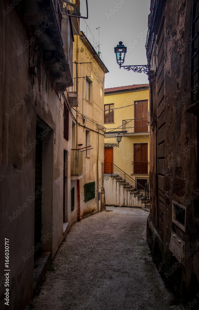 Narrow street in Mediterranean town during Siesta