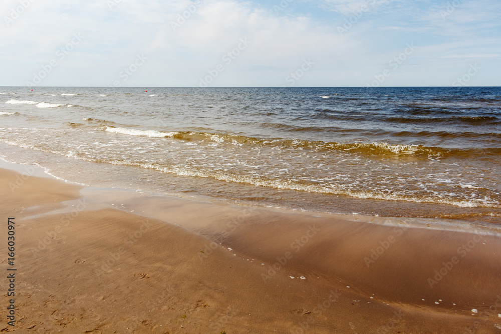 Fototapeta premium sunny summer scene of Baltic sea with beautiful seaside with waves.
