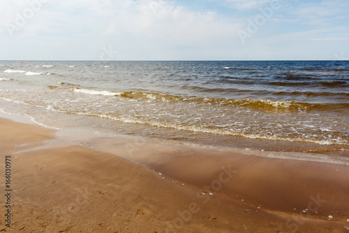 Fototapeta Naklejka Na Ścianę i Meble -  sunny summer scene of Baltic sea with beautiful seaside with waves.