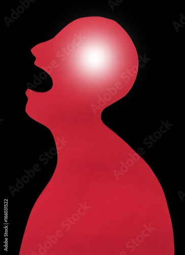 concept of human disease diagnosis and pain localization on silhouette - contour of abstract red male with fever, opened mouth and severe headache, isolated on black background, top view, flat lay.