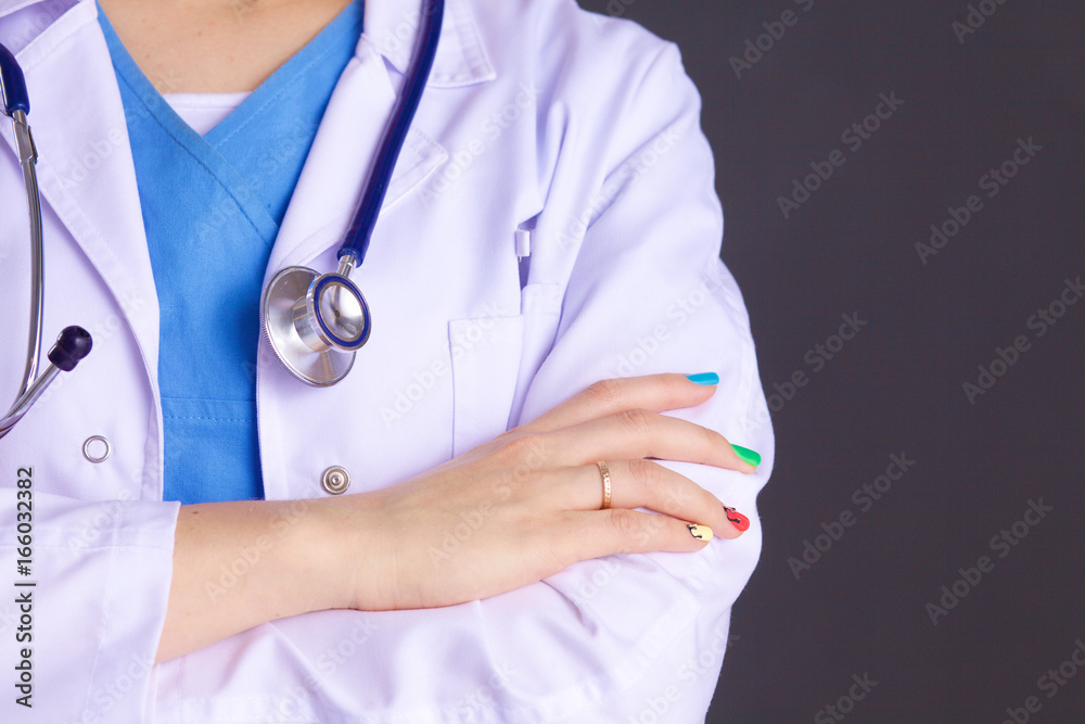 Woman doctor standing with folder at hospital Woman doctor standing with folder at hospital