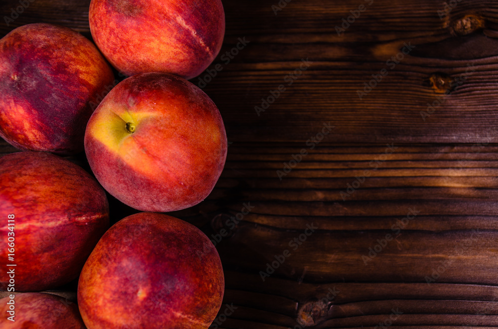 Fresh ripe peaches on wooden table. Top view Fresh ripe peaches on wooden table. Top view