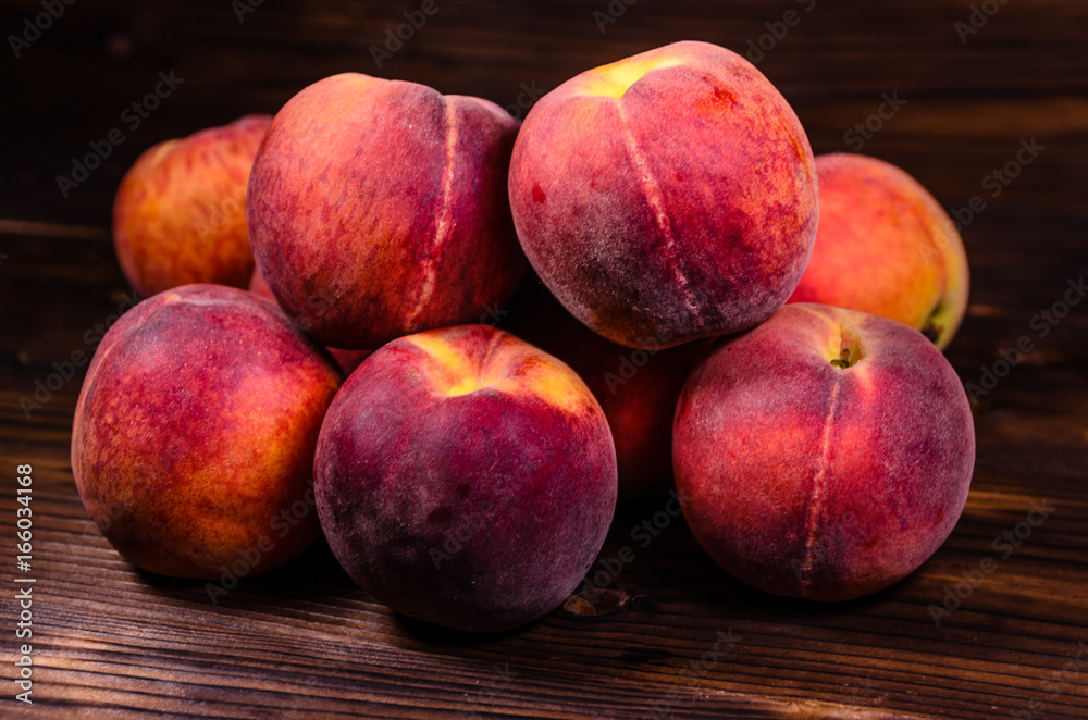 Fresh ripe peaches on wooden table Fresh ripe peaches on wooden table