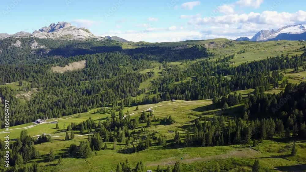 Aerial drone landscape of the meadows at high altitudes, forming gentle hills. Pine forest. Dolomites, Alta Badia, Sud Tirol, Italy Aerial drone landscape of the meadows at high altitudes, forming gentle hills. Pine forest. Dolomites, Alta Badia, Sud Tirol, Italy
