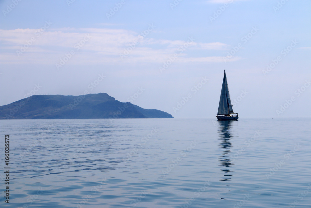 a lone sail boat