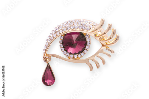 фотографія Gold brooch eye with diamonds аnd a large ruby isolated on white