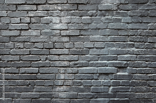 Old dark grey brick wall background texture