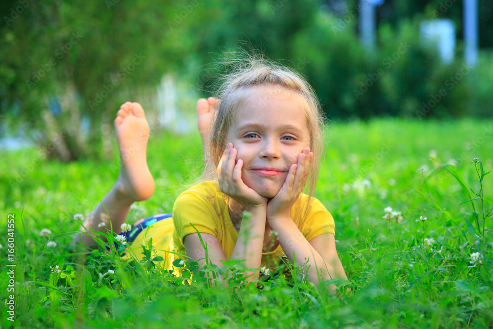 little girl relaxing on grass little girl relaxing on grass