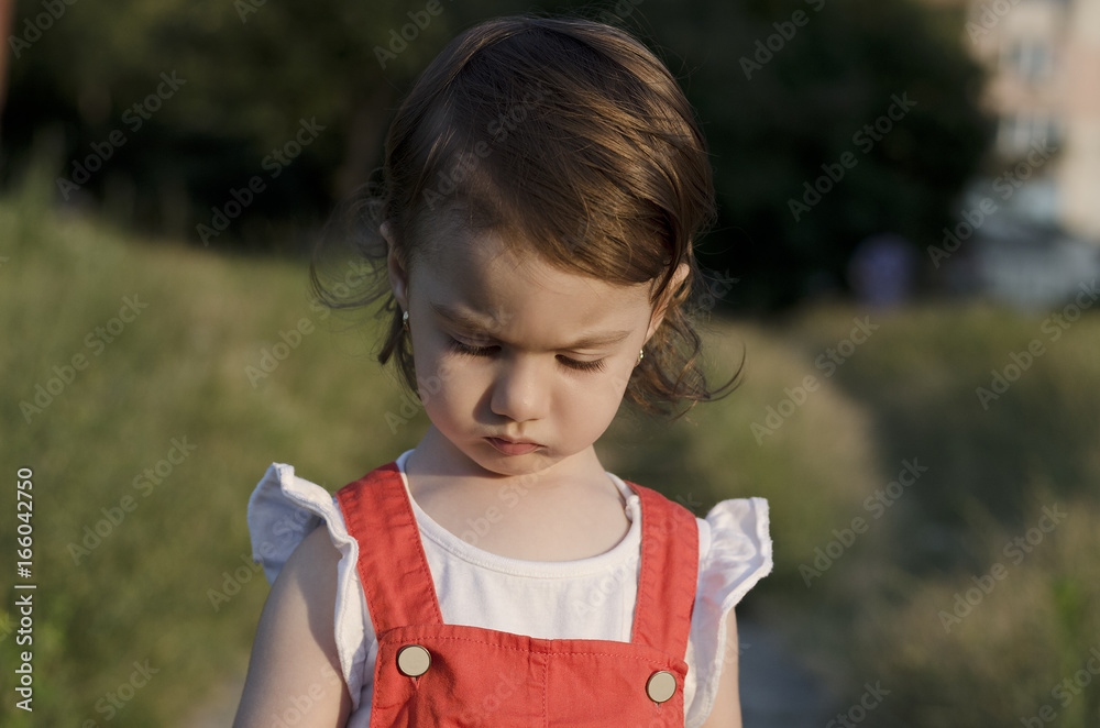 Small angel beauty with sparkling sunset in her eyes Small angel beauty with sparkling sunset in her eyes