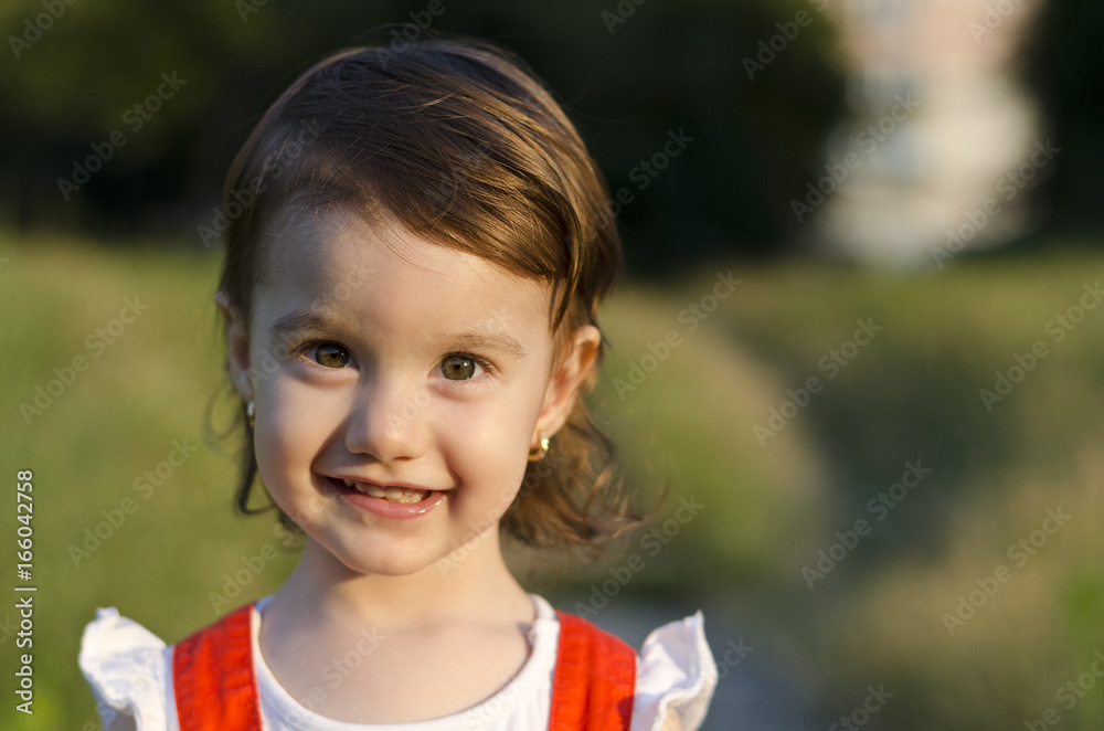 Small angel beauty with sparkling sunset in her eyes Small angel beauty with sparkling sunset in her eyes