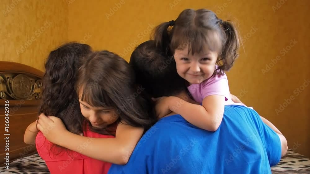 Children hugging their parents. Daughters hug their parents.