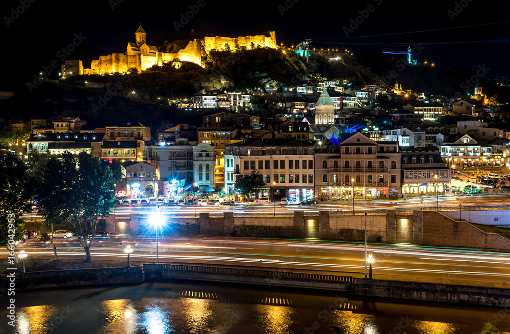 Night view of Narikala fortress and the old town of Tbilisi over river Kura, Georgia