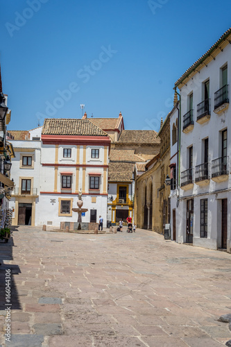 Cordoba, Spain - June 20 : A lone person walking on the streets of Cordoba on June 20, 2017.