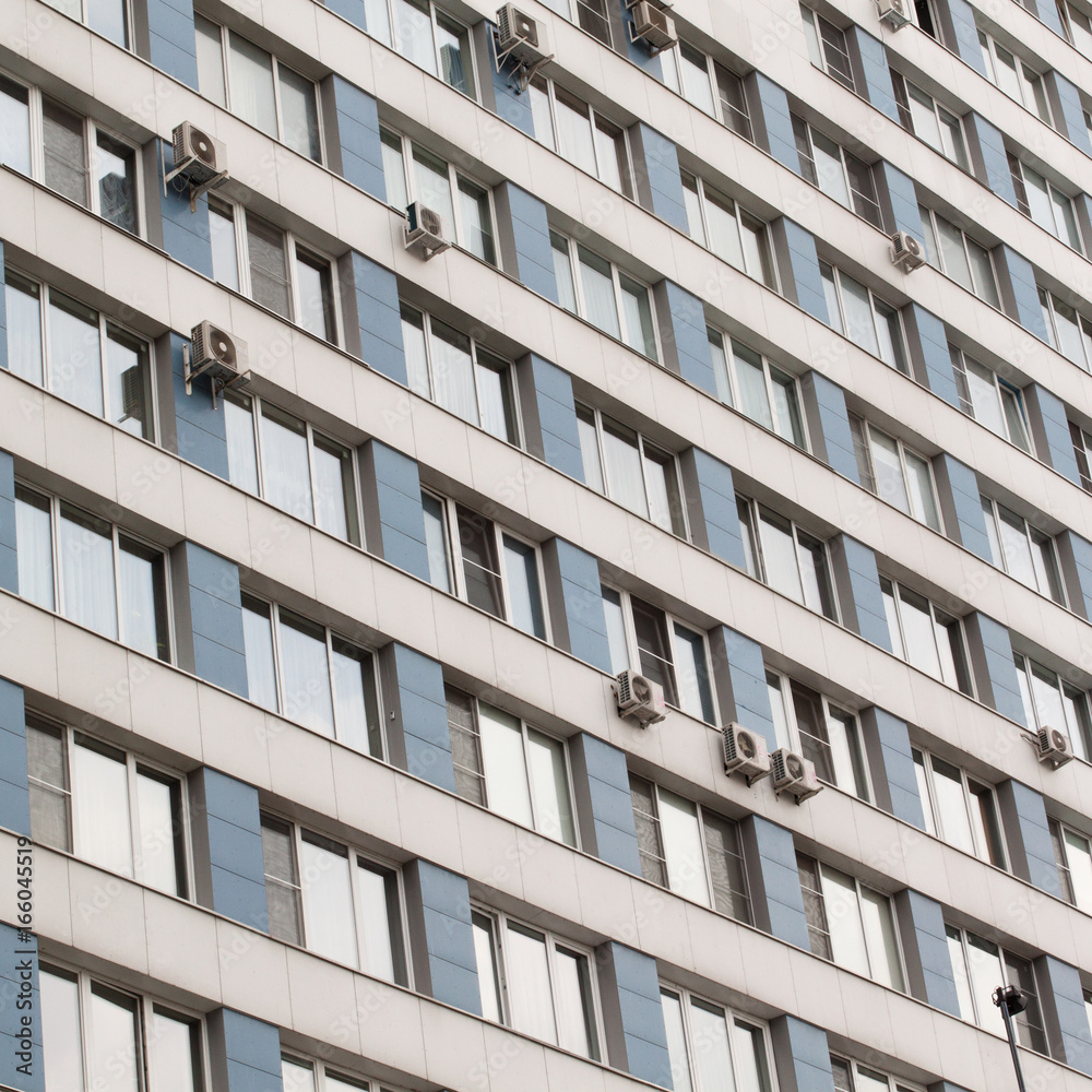 Facade of an apartment building with many windows Facade of an apartment building with many windows