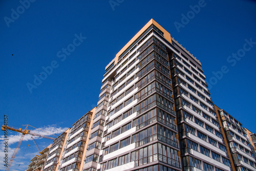 apartment building on blue sky background