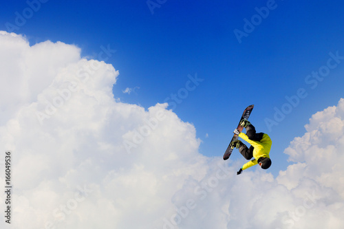 Snowboarder making jump