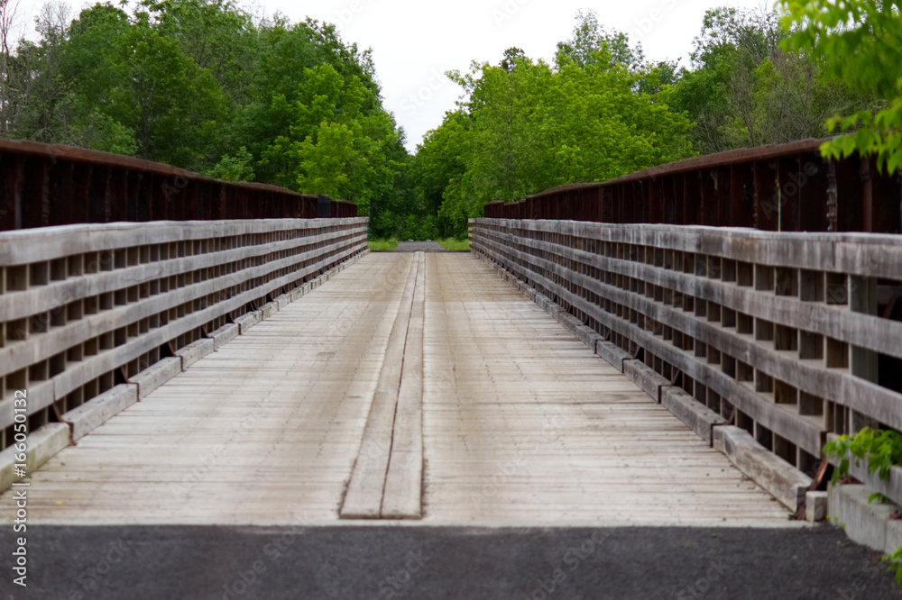 Long bridge with wood sidings giving a symmetrical look-stock photos