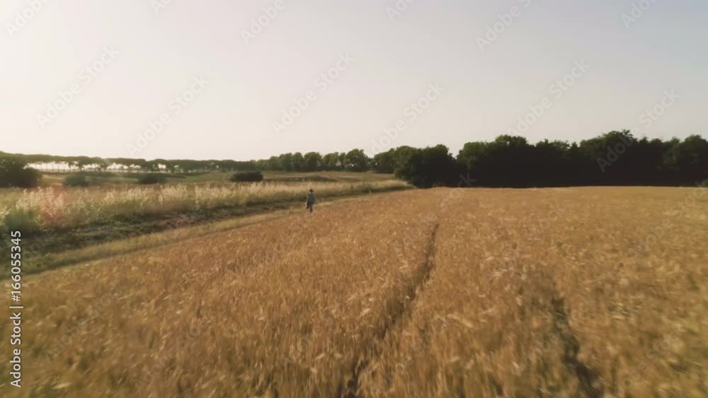 Little Girl with binoculars walking in open field Little Girl with binoculars walking in open field