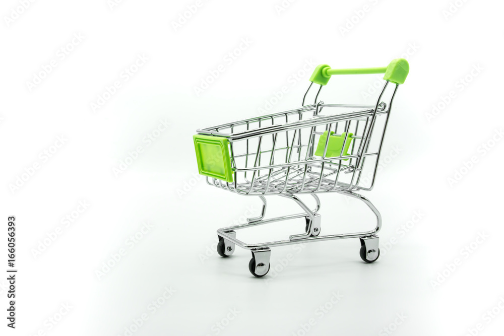 Green miniature shopping cart isolated on white