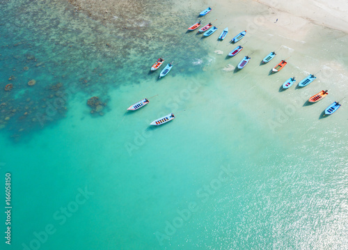 Aerial view from the drone on the wooden taxi boats near the sand beach of Thailand © Glebstock