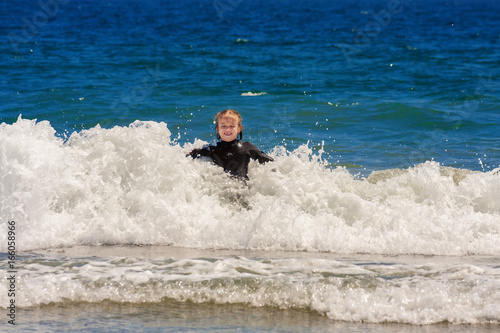 Girl Enjoys Playing In Ocean Waves © jbrown
